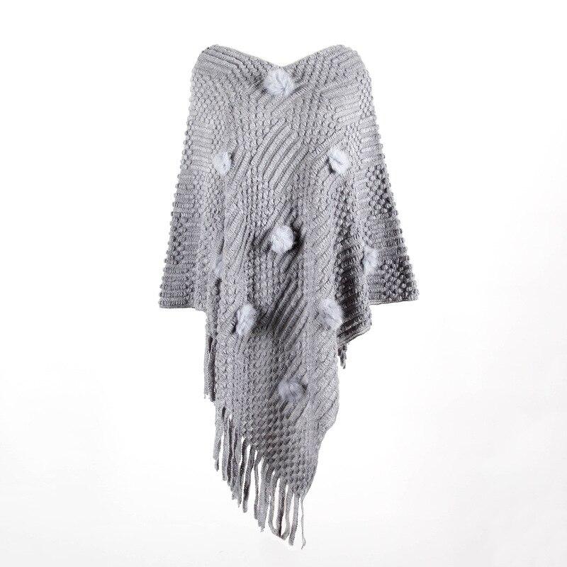 Poncho chic avec pompons