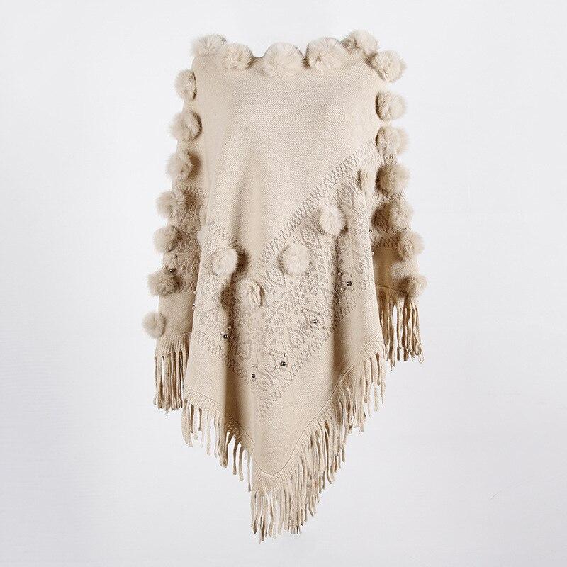 poncho avec pompon