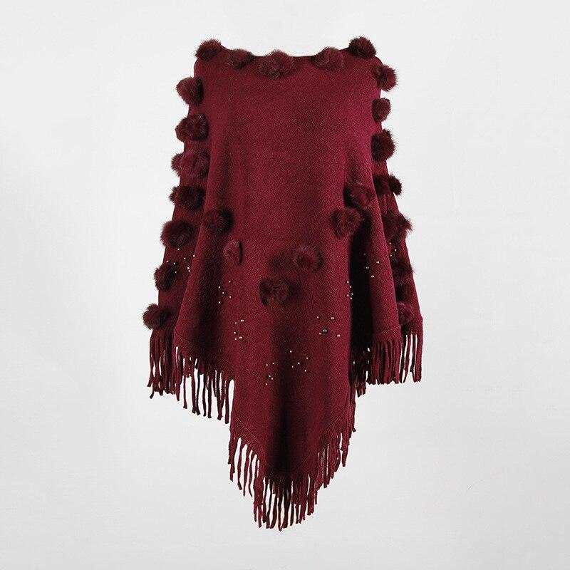 style unique poncho avec pompon